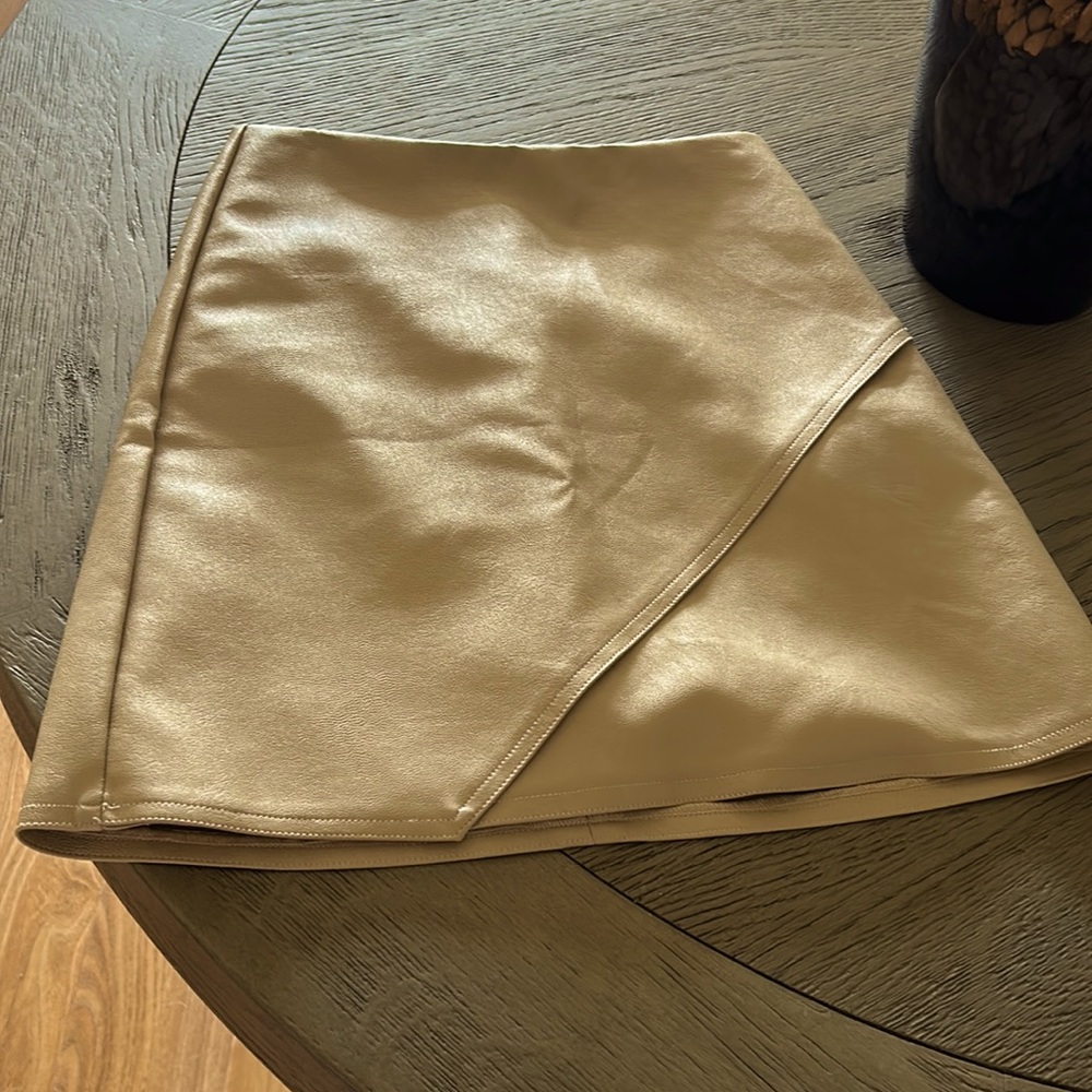 Adorable faux leather mini skirt. Excellent pre owned condition.